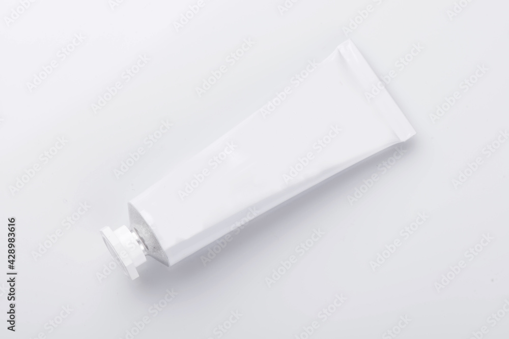 Top view of open blank cosmetic tube isolated on white Top view of open blank cosmetic tube isolated on white