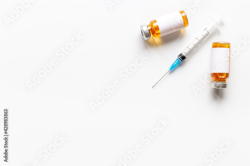 Medicine bottle for injection. Coronavirus vaccine ampoules with syringe