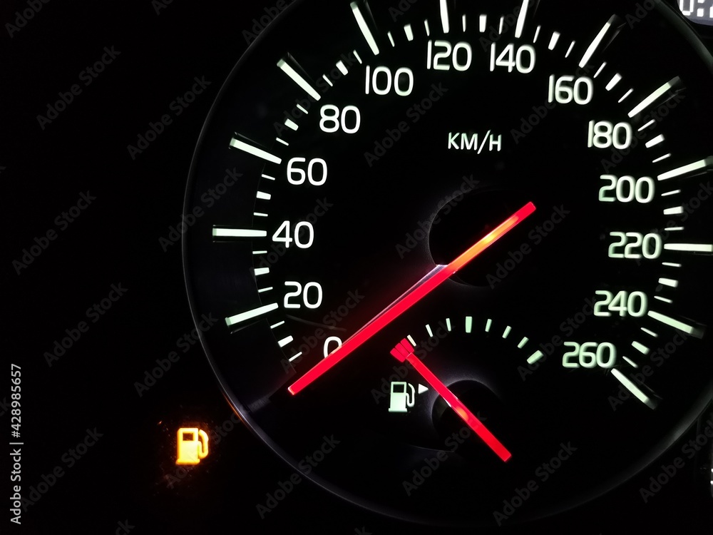Empty tank. Speedometer with an arrow at zero. The fuel has run out. Crisis. A car does not go. Speed 0. Vehicle dashboard. Dial with a red arrow. Illuminated night device. Urgent refueling is needed