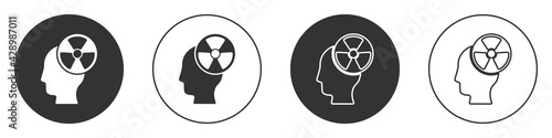 Black Silhouette of a human head and a radiation symbol icon isolated on white background. Circle button. Vector