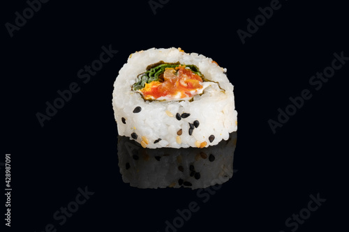 dried tomato sushi isolated on black background