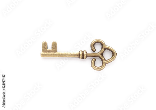 Decorative metal key on the empty white background