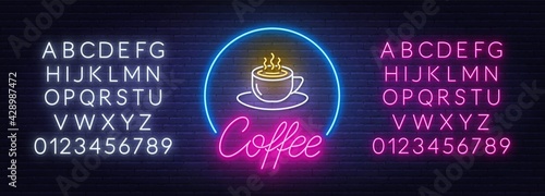 Coffee neon sign on brick wall background.