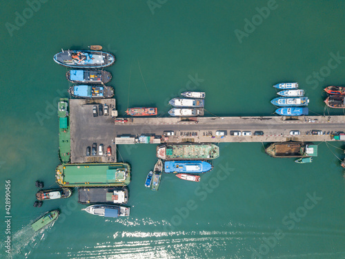 фотографія Aerial top view of fisherman dock which has many ships anchoring for transport s