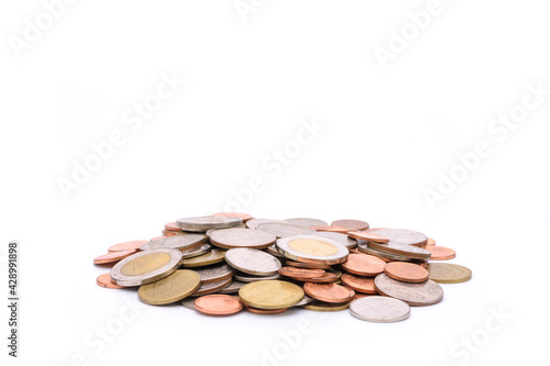 a pile of currency coins Investment, savings and profits business ideas isolated on white background