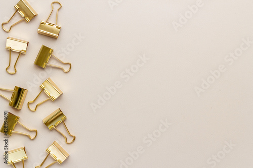 Office supplies background - paper binder clips top view © 9dreamstudio