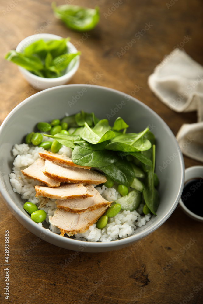 Healthy rice bowl with chicken and spinach Healthy rice bowl with chicken and spinach