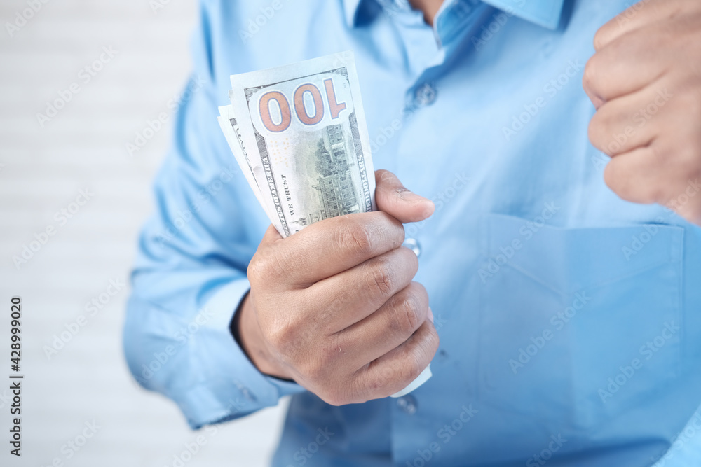 Close up of man hand counting 100 us dollar cash Close up of man hand counting 100 us dollar cash