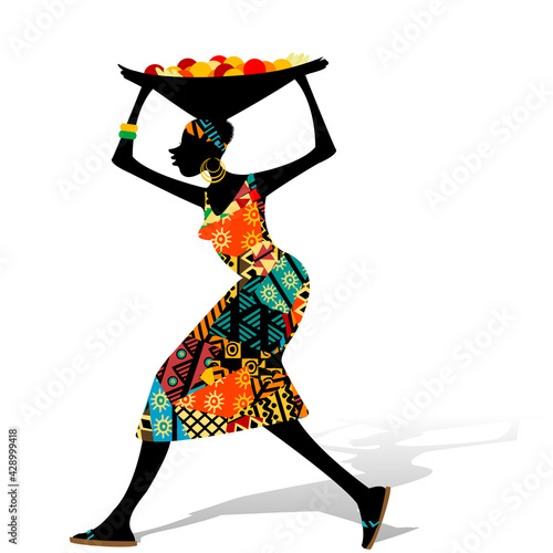 African woman carrying a basket of fruit