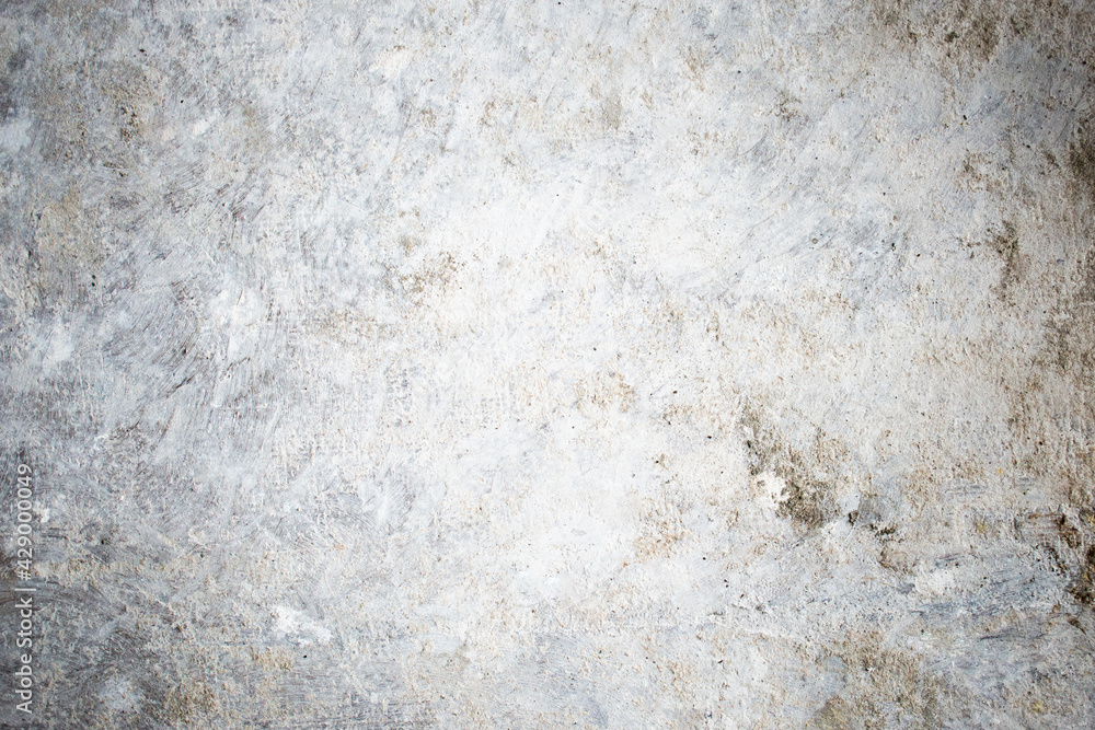White dirty dusty plain floor surface in a renovated building covered with dust from grinding and painting the walls. White dirty monochrome background. White dirty dusty plain floor surface in a renovated building covered with dust from grinding and painting the walls. White dirty monochrome background.