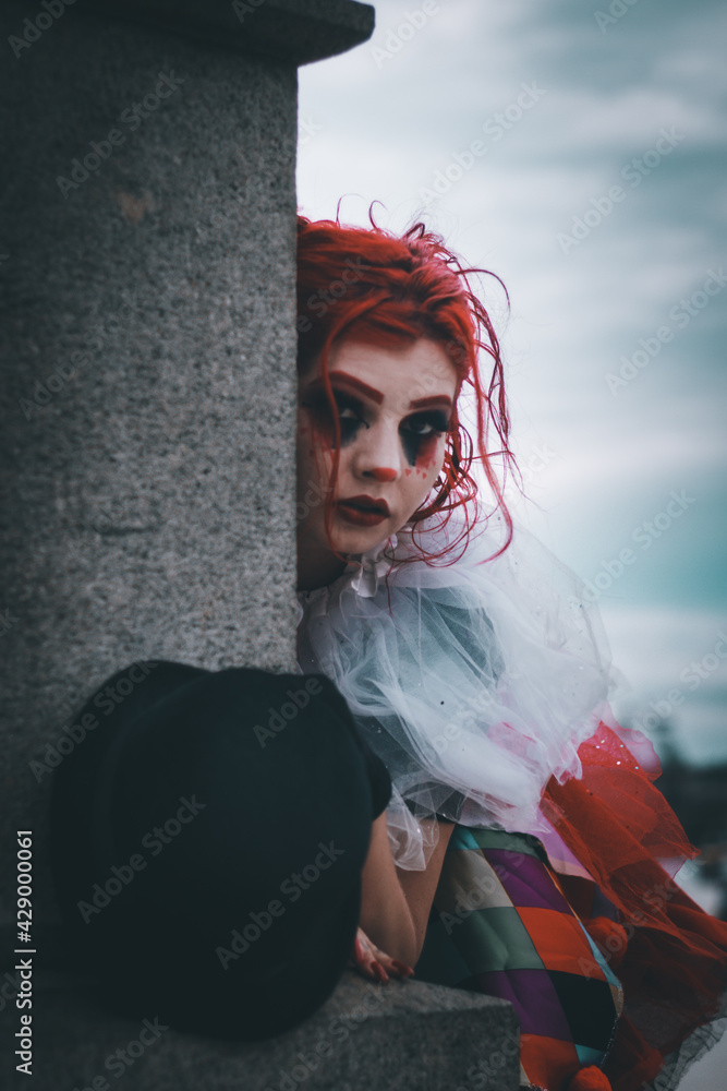 Beautiful young woman dressed as a clown, Beautiful girl dressed as a ...