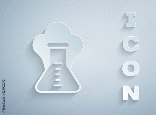 Paper cut Chemical experiment, explosion in the flask icon isolated on grey background. Chemical explosion in a test tube. Paper art style. Vector