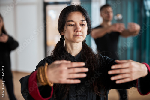 Face of lady with palms held in front of her