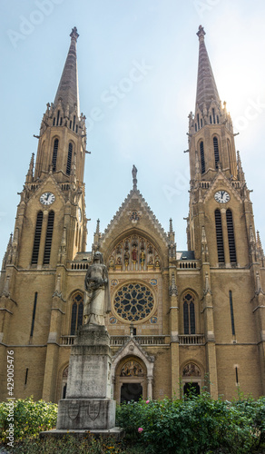 Budapest, Hungary - August 30 2019: Brick Gothic facade of the ancient Catholic Church of St. Elizabeth of the Arpad Dynasty in Budapest, the capital of Hungary. Gothic spiers of bell towers 