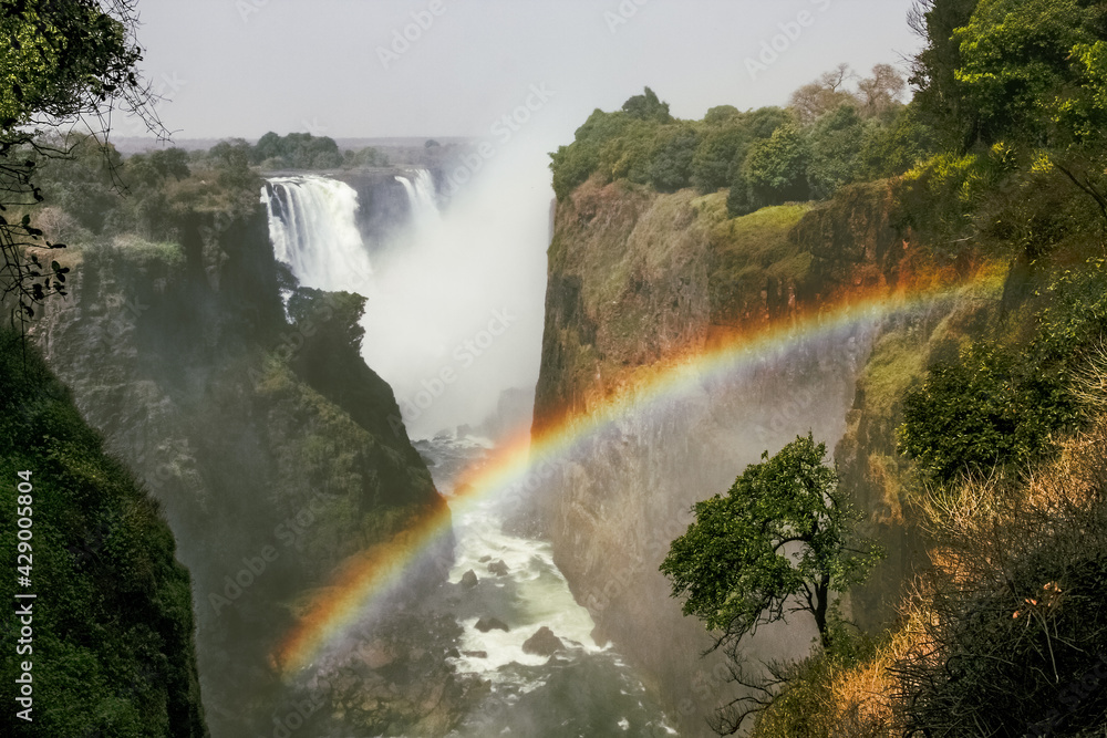 stunning view of Victoria Falls with a beautiful rainbow