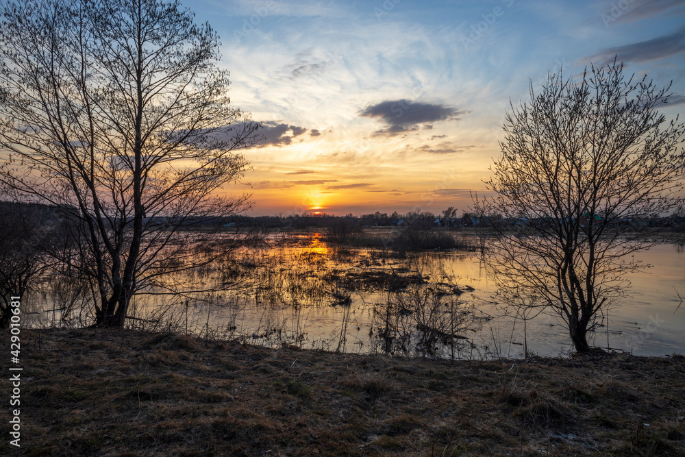 Sunset river quiet landscape view. Evening by the river. Sunset meditation. Romantic evening. The sun is low over the river.