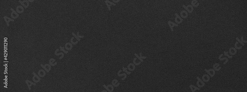 smooth black fabric cloth texture, dark background