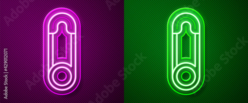 Glowing neon line Classic closed steel safety pin icon isolated on purple and green background. Vector
