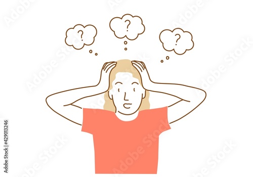 Girl holds her head with both hands