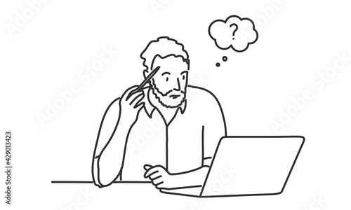 Bearded man with pen touch his head and looking at laptop.