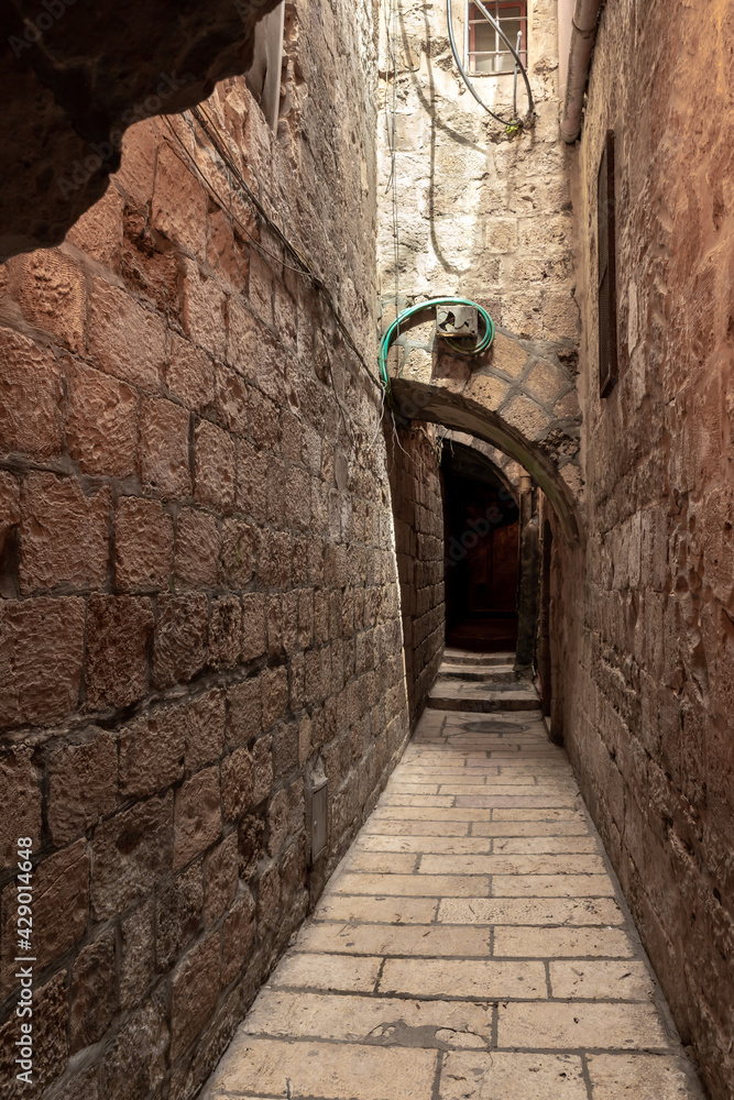 Old  architecture of the residential buildings in the Muslim quarter near the exit from the Temple Mount - Chain Gate, in the old city of Jerusalem, in Israel