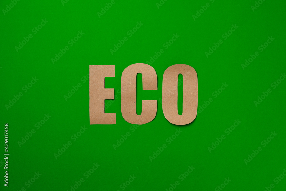 Paper recycling concept on green background top view Paper recycling concept on green background top view