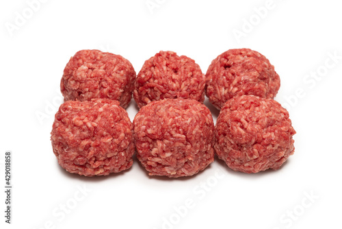 Raw meat balls isolated on white background.
