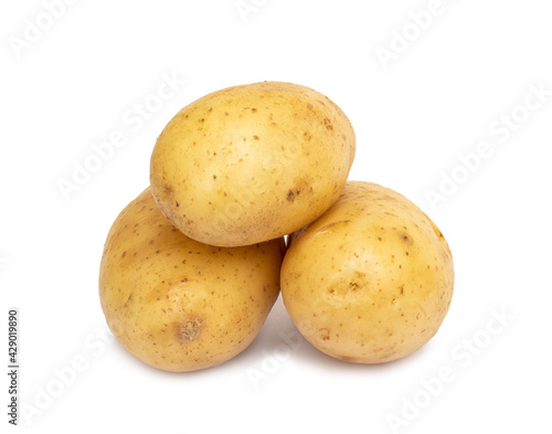 Pile of raw potatoes isolated on white background