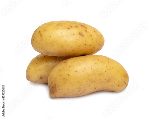 Pile of raw potatoes isolated on white background