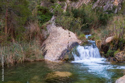 Idyllic waterfalls in a river, near Sot de Chera town, in Valencia (Spain) photo