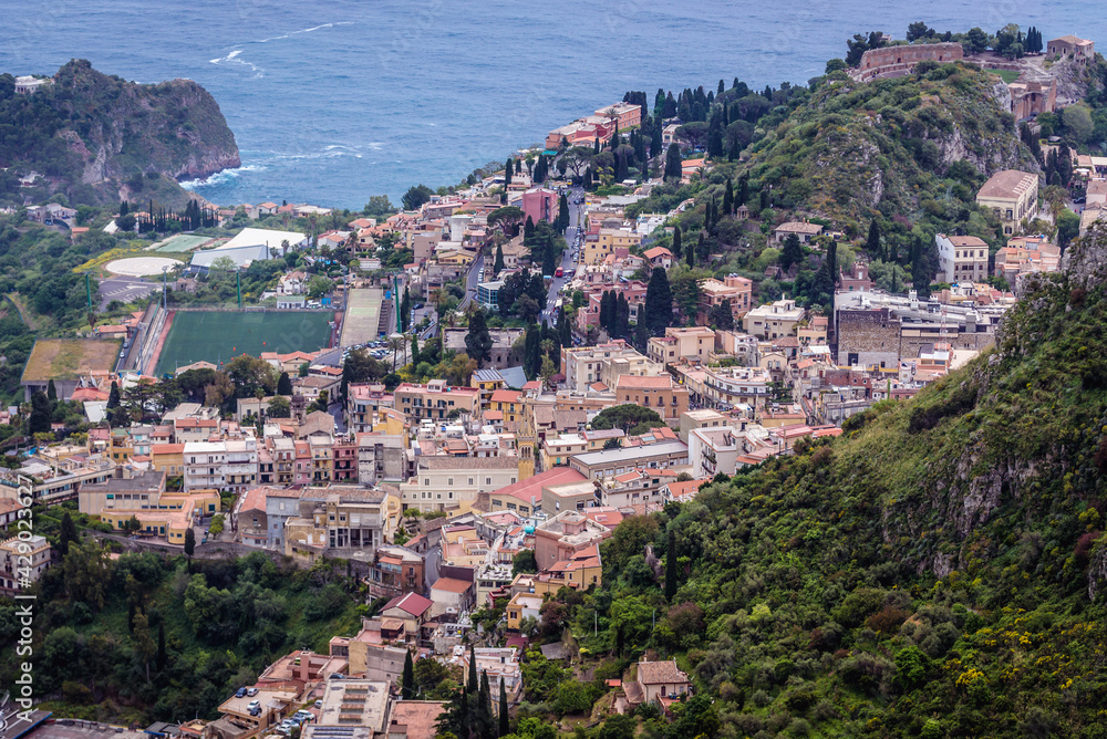 Taormina city seen from Castelmola town in the Province of Messina in the Italian region Sicily, Italy