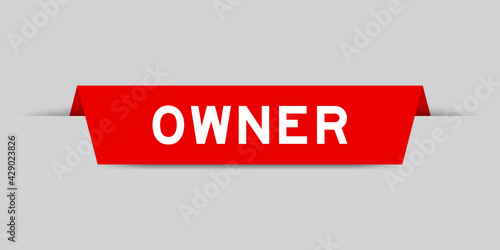 Red color inserted label with word owner on gray background