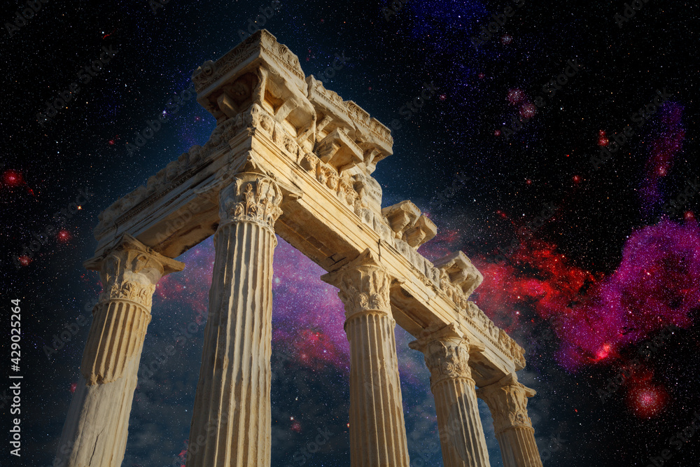 Architectural columns from the times of ancient greece. Ruins against the background of the night sky. Side turkey - obrazy, fototapety, plakaty 