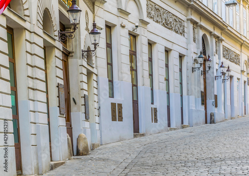 Vie of a white narrow street in the jewish quarter of Vienna, Austria. photo