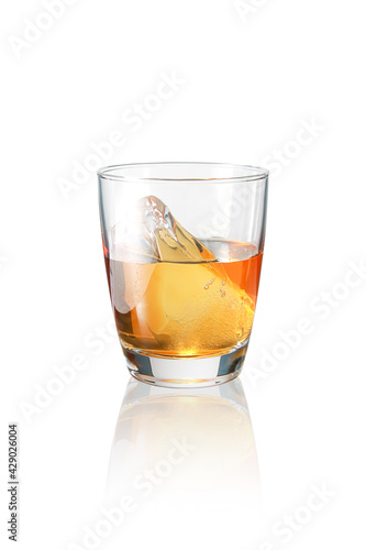 Ice and amber whiskey in a glass,with Clipping Path.