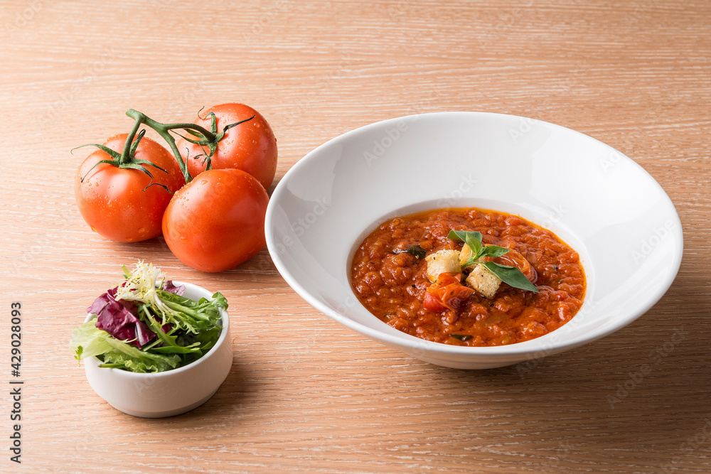 Italian Baked tomato gravy with toasted bread with beef tomato and salad Italian Baked tomato gravy with toasted bread with beef tomato and salad
