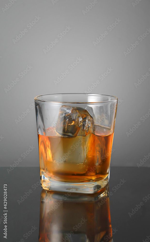 Dark whiskey glass with ice,with Clipping Path.