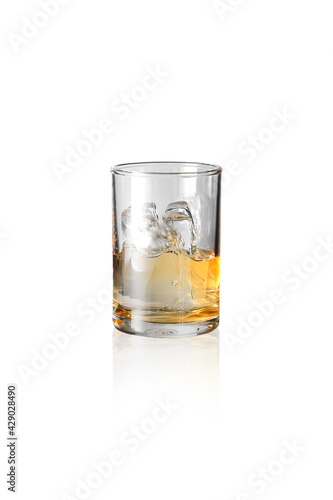 Whiskey and ice in a small glass,with Clipping Path.