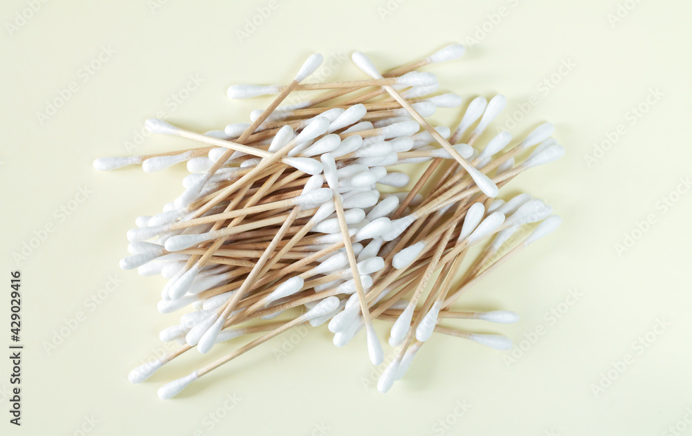 Bamboo cotton swabs buds sticks top view on beige background Bamboo cotton swabs buds sticks top view on beige background