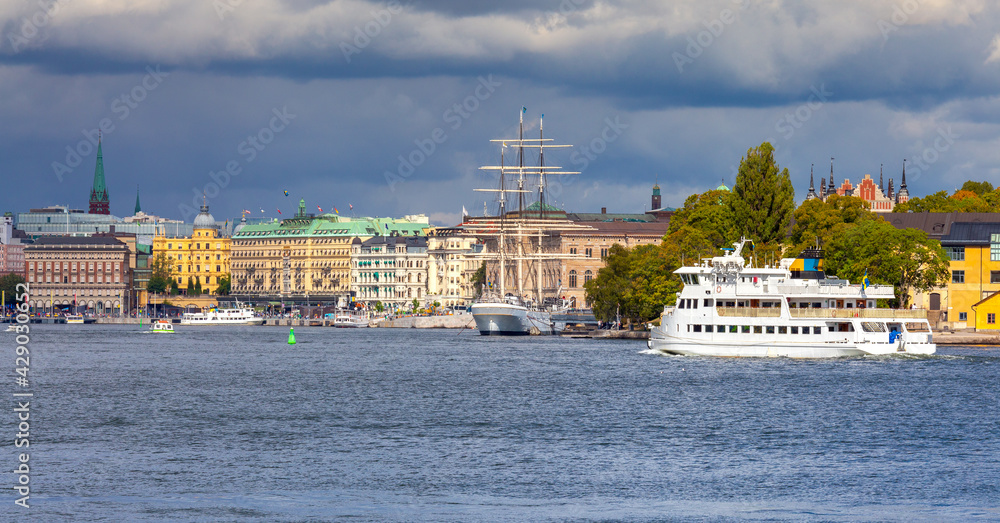 Obraz premium View of the city embankment on a sunny morning. Stockholm.