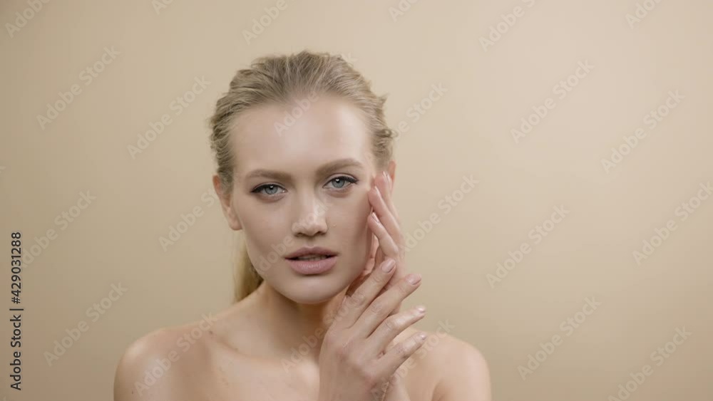Face Of Stylish Young Model With Beautiful Skin. Girl Posing Touching Hand To Face. Face Of Stylish Young Model With Beautiful Skin. Girl Posing Touching Hand To Face.