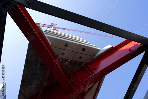 Huge red crane at construction site for skyscraper Franklinturm. Photo taken April 20th, 2021, Zurich, Switzerland.