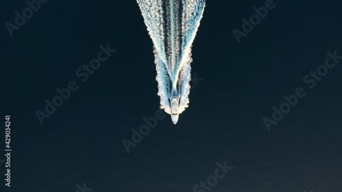 Croatia. Aerial view of luxury floating boat on blue Adriatic sea at sunny day. Fast boat on the sea surface. Seascape from drone. Travel video