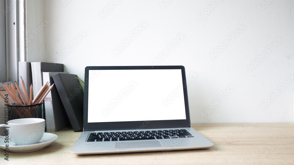 Laptop computer with white blank screen on wood desk. Workspace, workplace, desktop office concept. Laptop computer with white blank screen on wood desk. Workspace, workplace, desktop office concept.