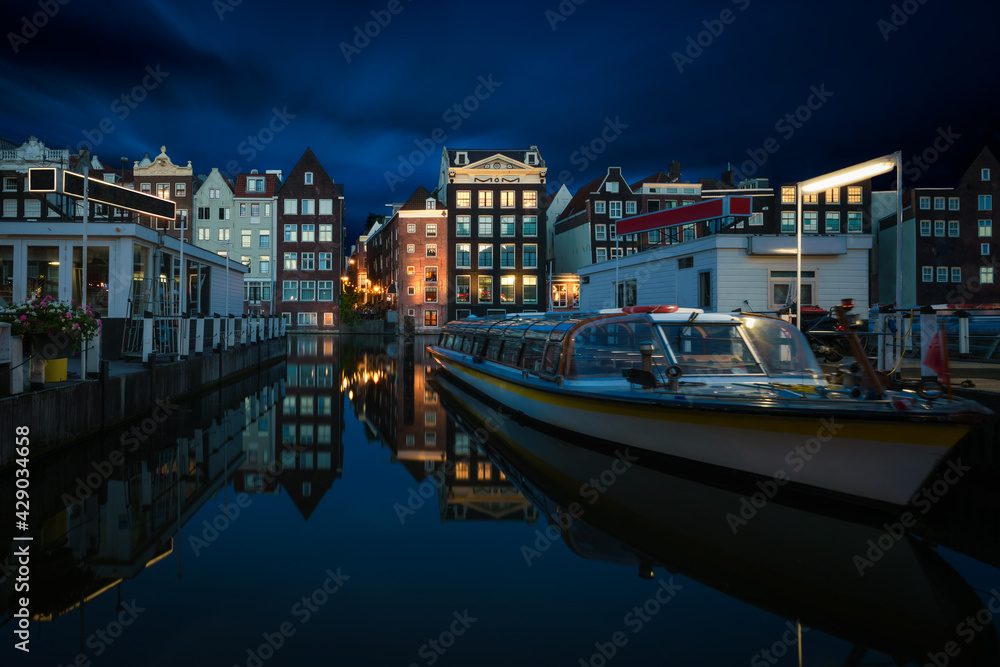 The traditional dutch houses of Amsterdam at night, The Netherlands