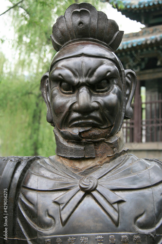 statue of a guardian     in the jinci monastery in taiyuan in china 