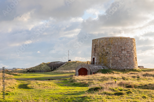 British Lewis Tower with nazi bunker in the background, Saint Quen, bailiwick of Jersey, Channel Islands