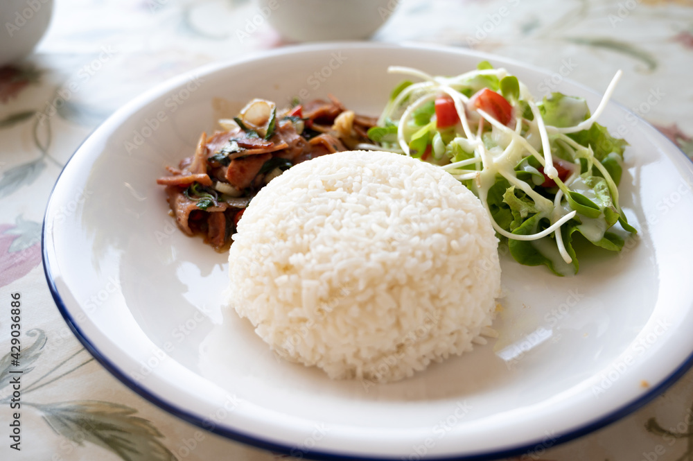 Stir fried Thai basil with Bacon and salad. Stir fried Thai basil with Bacon and salad.