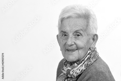 portrait of senior woman on white background, black and white