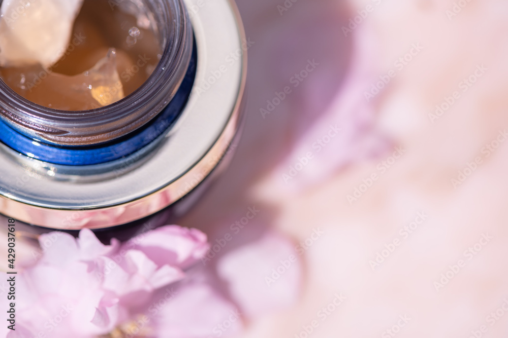 Cosmetics and beauty products on a pink marble table Cosmetics and beauty products on a pink marble table